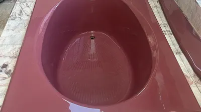 Refinished bathtub surface with durable high-gloss finish