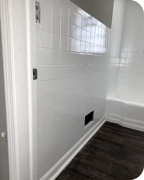 Tile reglazing service renewing bathroom walls and floors